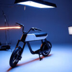 Electric bike displayed in a studio, used as urban cycling and micromobility context