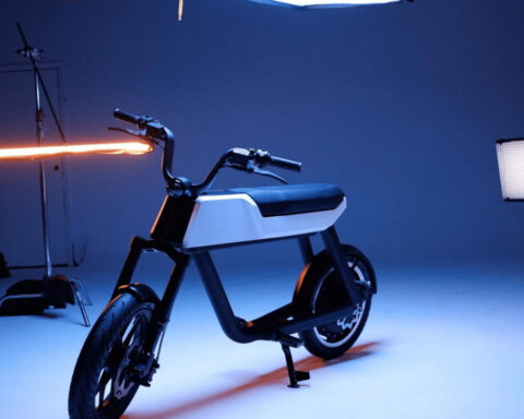 Electric bike displayed in a studio, used as urban cycling and micromobility context