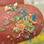 Artist Impression of Microplastic on Finger, Photo Credit: Giganectar, {CC BY-SA 4.0 DEED}