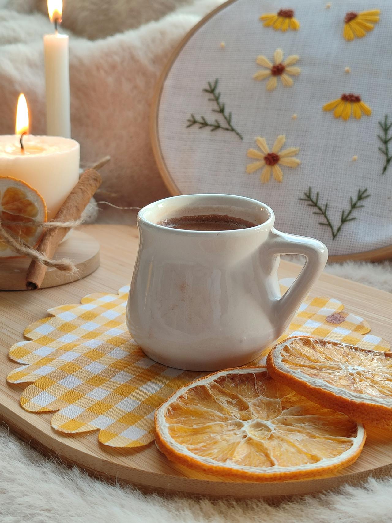 Cozy Autumn Scene with Hot Drink and Candle