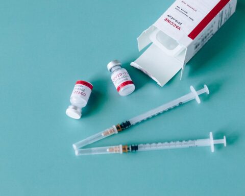 Representative Image. 2 vials labeled "COVID-19 Vaccine" accompanied by two syringes, Photo Source - Nataliya Vaitkevich (CC0 1.0)