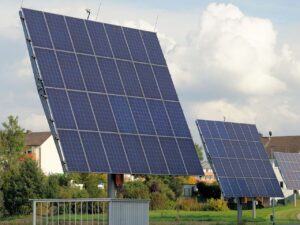 Representative Image. A solar farm with an array of large solar panels mounted on angled metal frames. Photo Source - Webandi (CCO 1.0)