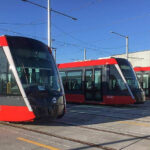 Representative Image. 3 sleek, modern trams parked at an outdoor tram depot. Photo Source - John Cowper (CC BY 2.0)