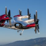 Electric aircraft flying against a blue sky, used as aviation technology context for Virgin Atlantic coverage