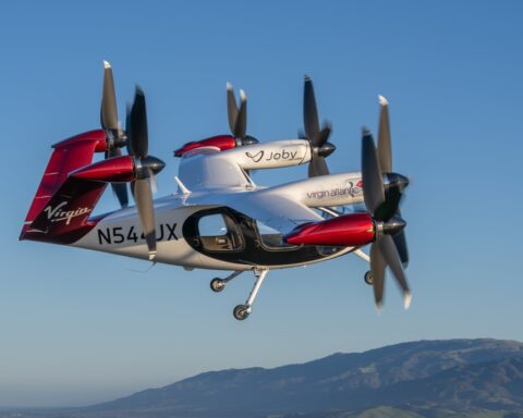 Electric aircraft flying against a blue sky, used as aviation technology context for Virgin Atlantic coverage
