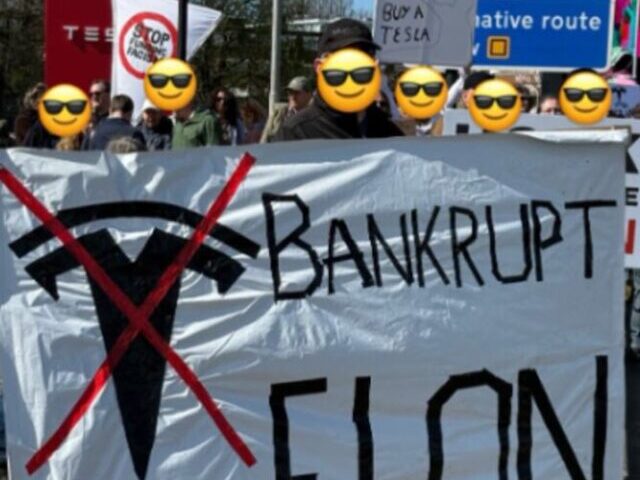 A protest scene outside a Tesla facility, where demonstrators are holding banners and signs opposing Tesla and its CEO, Elon Musk. Photo Source: JimmieG (Twitter)