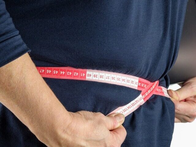 Representative Image. Measuring Belly with Measuring Tape.