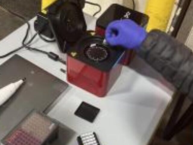 Florida International University scientist Diego Cardeñosa inserts the collected samples from imported fish into the PCR device to identify the fish species. Photo Source:: NOAA Fisheries