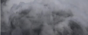 A thick, heavy cloud of grey smoke or fog swirling around. Photo Source: OVSICORI- UNA (YouTube)