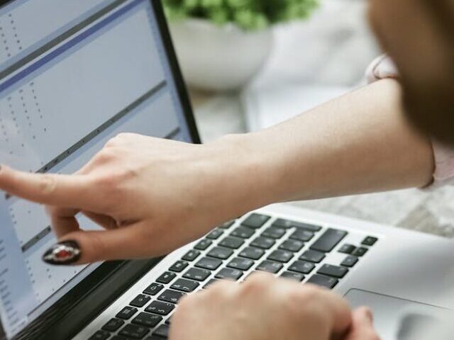 Representative Image: Person Pointing Finger on Laptop Screen. Photo Source: Mikhail Nilov (Pexels)