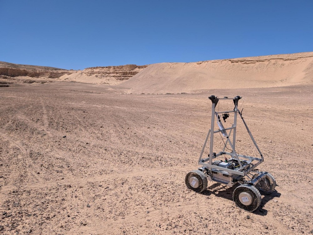 Lunar GPS LUPIN Enables Real-Time Navigation at 1.0 m/s Over 7 km in Moon-Like Terrain