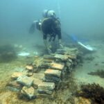 Marine archaeologist and research professor David Gregory from the National Museum of Denmark at piled bricks on the seabed in Costa Rica. Photo Source: Jakob Olling, The National Museum of Denmark
