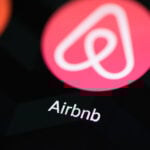 Airbnb app icon on smartphone screen