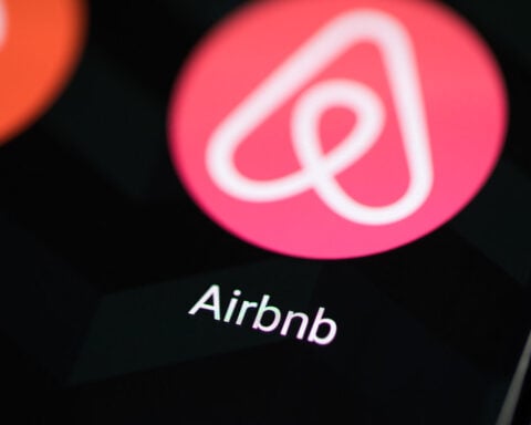 Airbnb app icon on smartphone screen