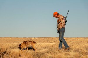 Representative Image Hunter with hunting dog, Photo Source: Strange Biology (CC BY 2.0)