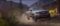 A Ford pickup truck driving on a rugged dirt trail through a scenic mountainous landscape. Photo Source: Ford