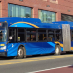 An MTA bus at Bay E of Jamaica Center in Queens, NYC – a busy public transit hub. Photo Source: Tdorante10 (CC BY-SA 4.0)