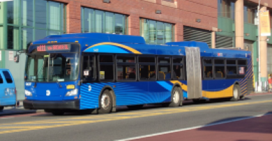 An MTA bus at Bay E of Jamaica Center in Queens, NYC – a busy public transit hub. Photo Source: Tdorante10 (CC BY-SA 4.0)