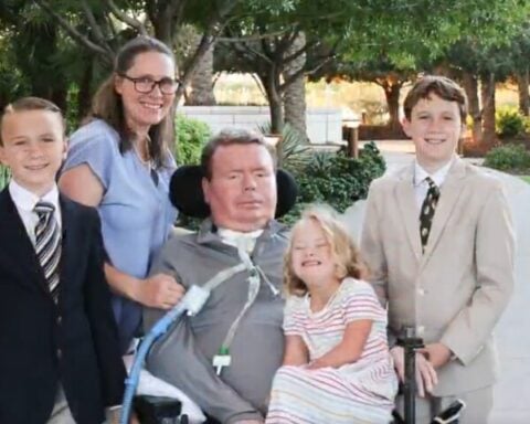 A family posing together outdoors in a park-like setting. Photo Source: Bradford G Smith (Brad) (X)