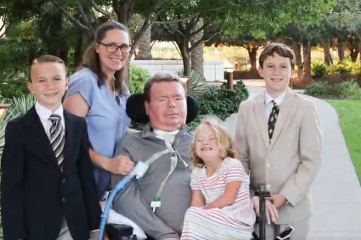 A family posing together outdoors in a park-like setting. Photo Source: Bradford G Smith (Brad) (X)