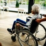 Senior Sitting in a Wheelchair in a Nursing Hom Photo Source: Jsme MILA