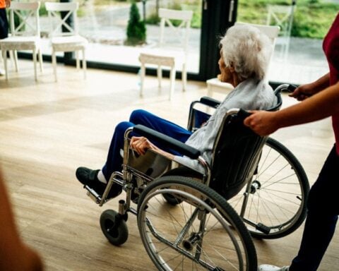 Senior Sitting in a Wheelchair in a Nursing Hom Photo Source: Jsme MILA