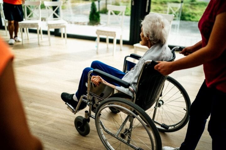 Senior Sitting in a Wheelchair in a Nursing Hom Photo Source: Jsme MILA