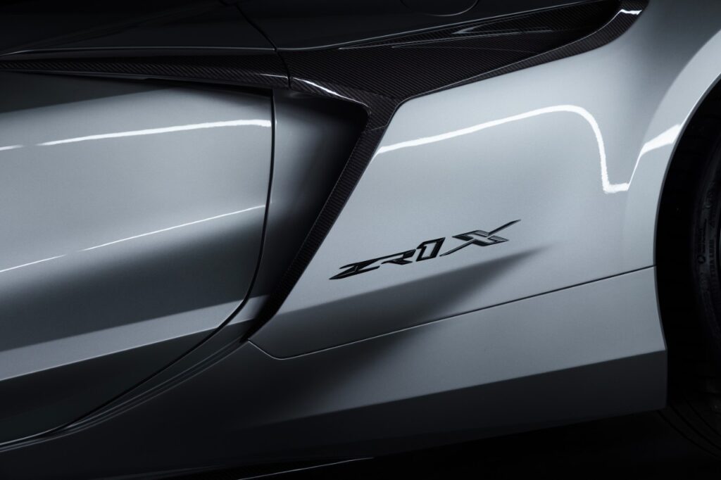 New Corvette ZR1X badge on 2026 Corvette ZR1X in Blade Silver Metallic. Preproduction model shown, actual production model may vary.