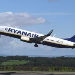 A large passenger jet taking off from an airport runway. Airplane aircraft commercial.