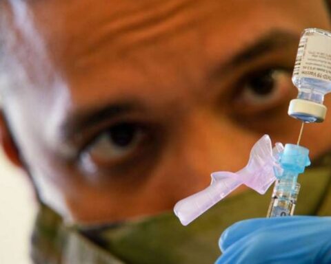 SPC Anthony Ariola prepares a dose of the Covid vaccine Photo Source: DVID Service