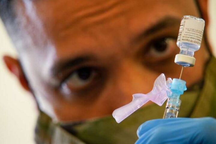 SPC Anthony Ariola prepares a dose of the Covid vaccine Photo Source: DVID Service