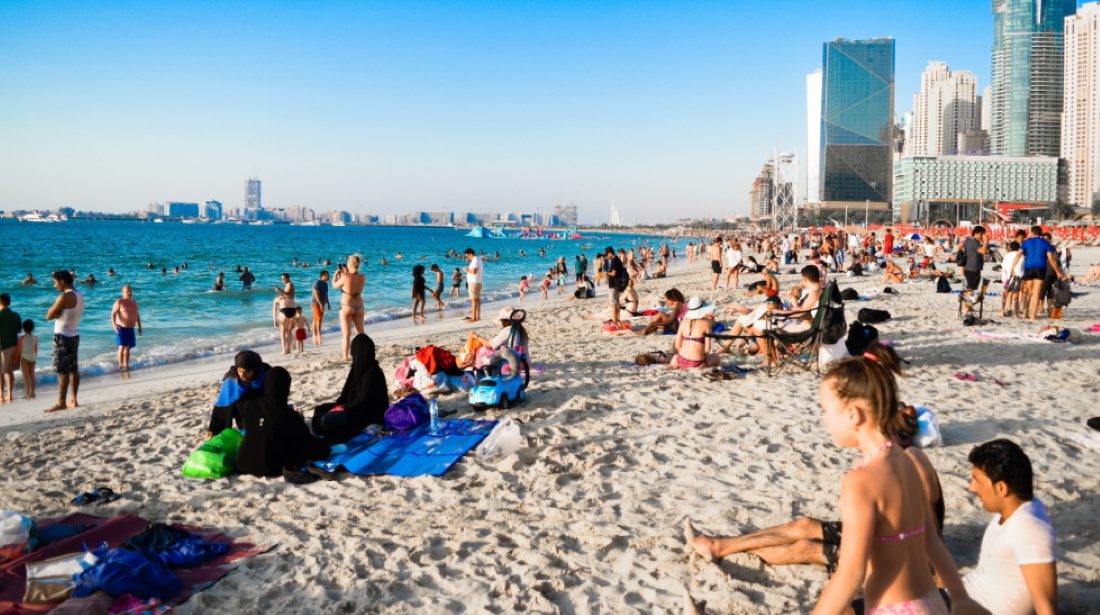 Beach blue sky buildings children Dubai enjoyment fun group Photo Source: PxHere