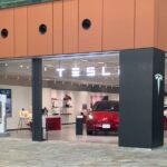 A Nissan Leaf and a Tesla vehicle in the Minatomirai district. Photo Source: Tesla