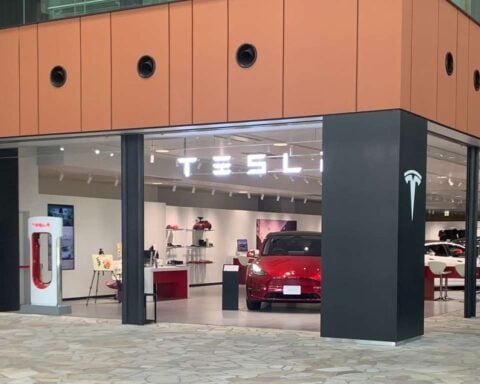 A Nissan Leaf and a Tesla vehicle in the Minatomirai district. Photo Source: Tesla