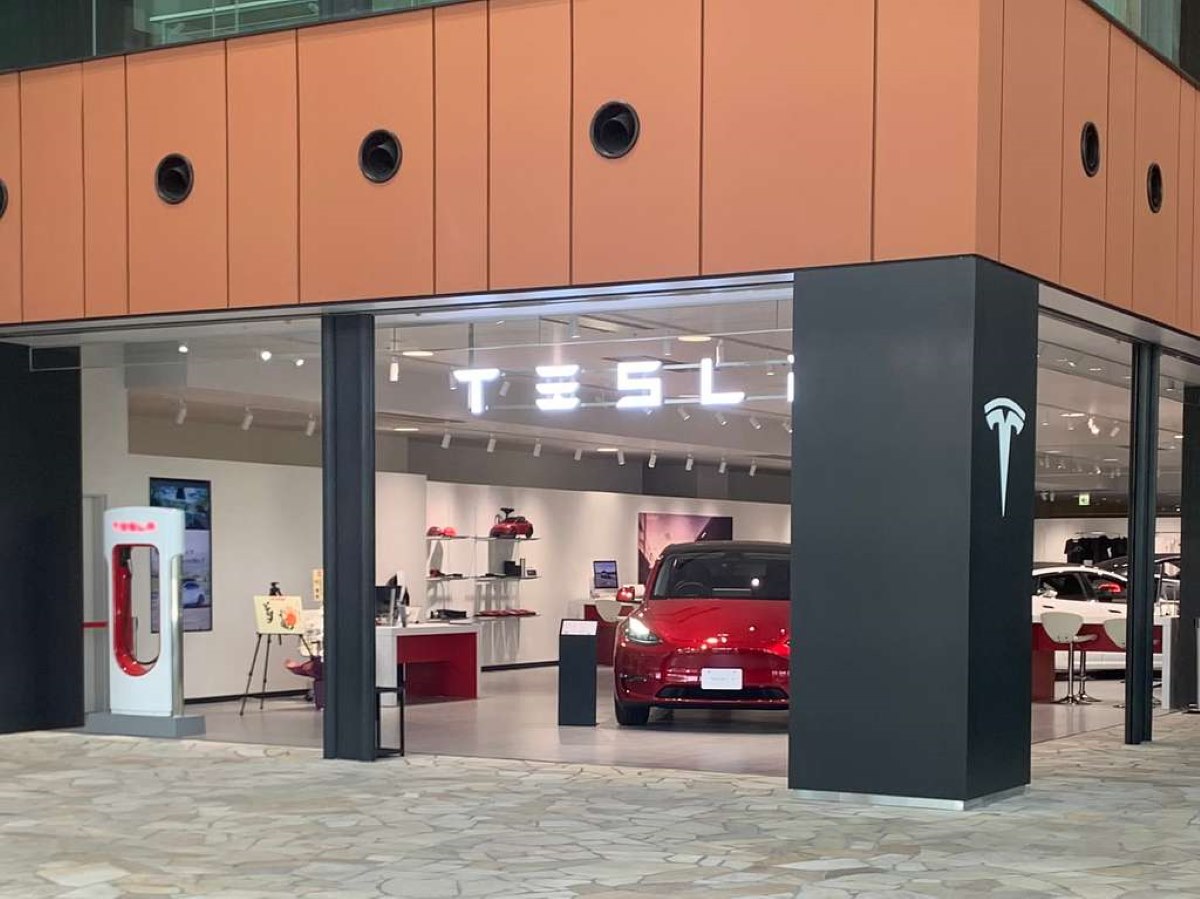 A Nissan Leaf and a Tesla vehicle in the Minatomirai district. Photo Source: Tesla