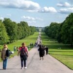 Tourists Walking Along the Road Through Windsor Great Park Photo Source: Eren Cebeci