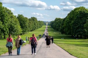 Tourists Walking Along the Road Through Windsor Great Park Photo Source: Eren Cebeci