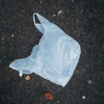 Close-up of a plastic bag thrown on the ground. Plastic waste Photo Source: Ivan Radic (CC BY 2.0)