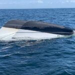 Representative Image- A 26-foot boat sits capsized 26-miles west of Homosassa, Florida, Saturday, March 30, 2019. A Coast Guard Air Station Clearwater Mh-60 Jayhawk helicopter crew rescued four people from the capsized boat. (U.S. Coast Guard photo by Seaman Levi G. Mcfarland)
