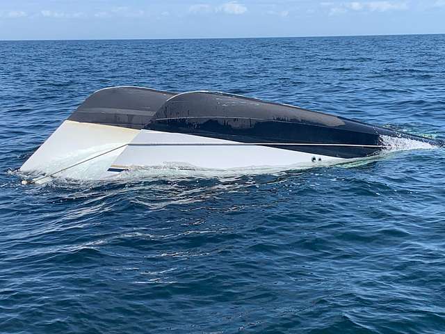 Representative Image- A 26-foot boat sits capsized 26-miles west of Homosassa, Florida, Saturday, March 30, 2019. A Coast Guard Air Station Clearwater Mh-60 Jayhawk helicopter crew rescued four people from the capsized boat. (U.S. Coast Guard photo by Seaman Levi G. Mcfarland)