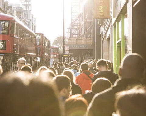 People walking in the street of London.