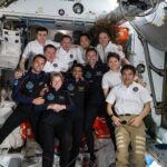 The Axiom Mission 4 and Expedition 73 crews join together for a group portrait inside the International Space Station’s Harmony module.