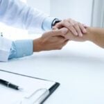 Doctor Holding Hands