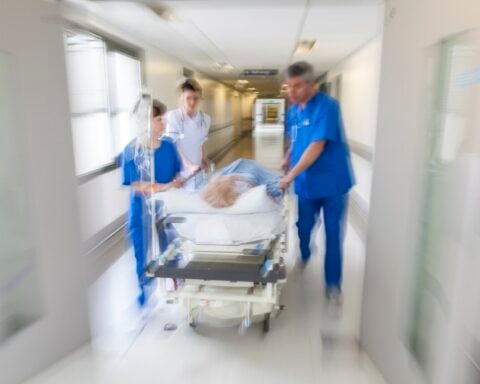 Representative Image: A patient on stretcher being pushed through a hospital corridor. Photo Source: PixHere