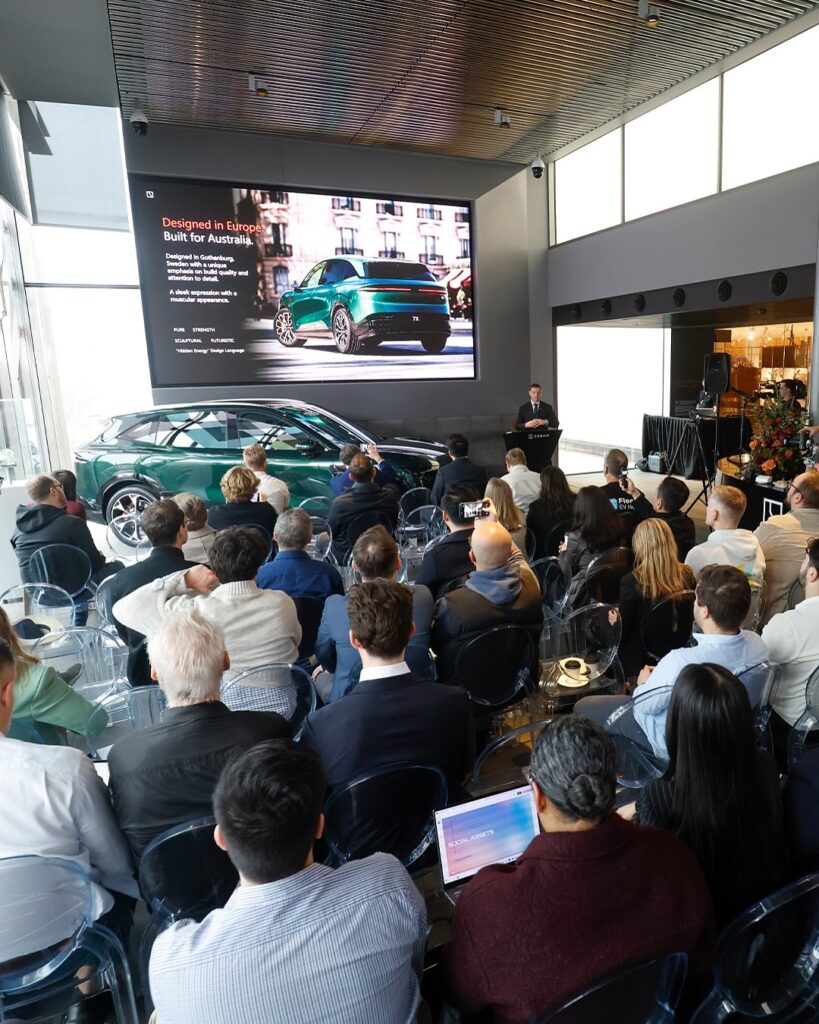  Audience at the Zeekr 7X Australian launch event listening to presentation.
