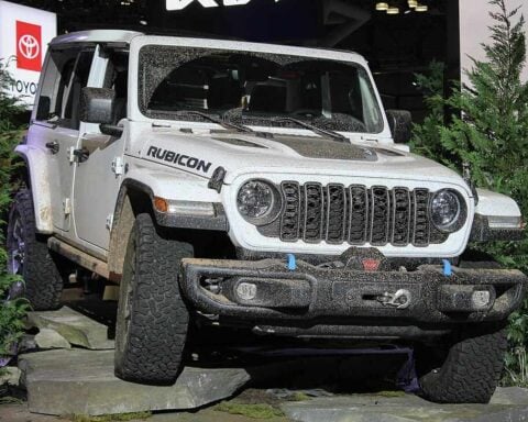 2024 Jeep Wrangler Unlimited Rubicon showcased on rocky display at auto show