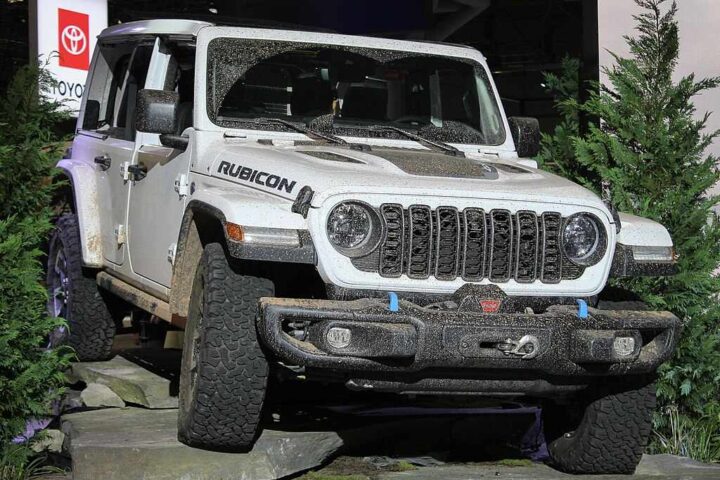 2024 Jeep Wrangler Unlimited Rubicon showcased on rocky display at auto show