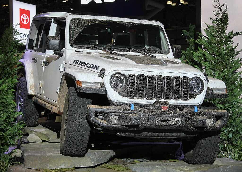 2024 Jeep Wrangler Unlimited Rubicon showcased on rocky display at auto show