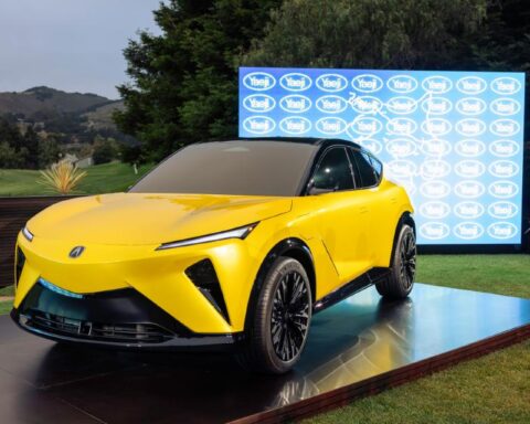 Acura RSX Prototype displayed at Monterey Car Week in Propulsion Yellow Pearl, marking the debut of ASIMO OS and Acura’s first in‑house EV platform