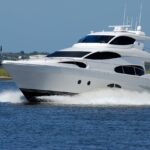 Representative Image. White Yacht on Running on Blue Body of Water during Daytime